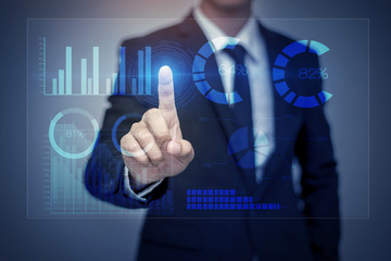 Businessman in suit working with digital virtual screen