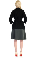woman in a blouse and skirt back isolated on white