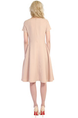 Girl in dress from the back isolated on white