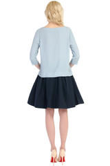 woman in a skirt from the back isolated on white