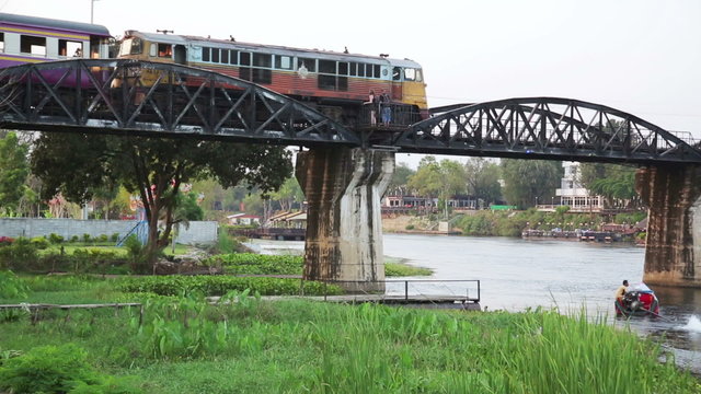 historical train at bridge over kwai river death railway