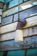 lamp on wooden wall
