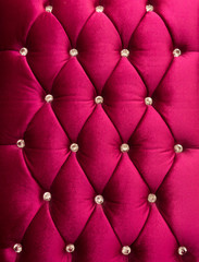 Red upholstery velveteen decorated with crystals as texture and