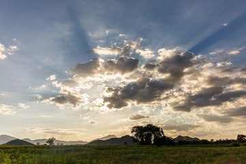 The sun sets behind the mountains