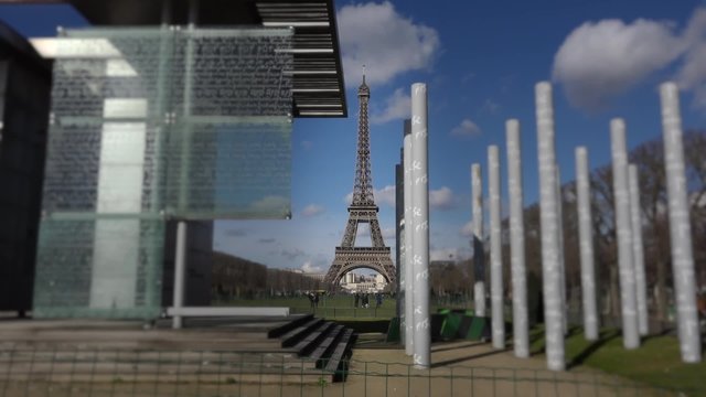 Eiffel tower peace monument out of focus - 60fps. Frontal shot Eiffel tower peace monument out of focus - 1080p