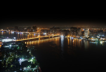 Fototapeta premium Aerial view of Nile river and bridge Cairo Egypt at night
