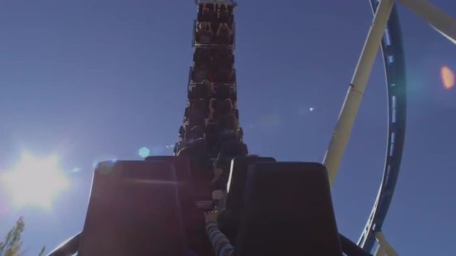 Shot from the back of a rollercoaster riding the twists of the track.