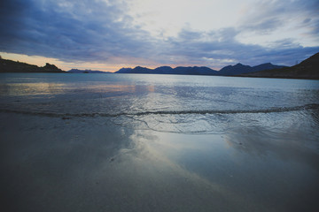 Sunset or dusk on a beautiful norwegian white sand beach, Lofoten Islands