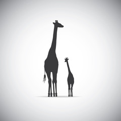 Naklejka premium Vector silhouette of mother giraffe with her baby