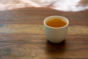 cup of tea on vintage wooden background.