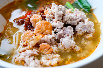 Close up of Thai Spicy noodle soup in a bowl (Tom Yam)