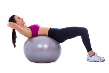 Fototapeta premium slim woman in sports wear doing exercises on fitness ball isolat