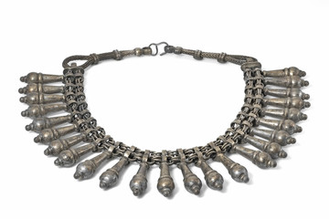 Old antique tribal silver necklace / Old antique tribal silver necklace on white background.