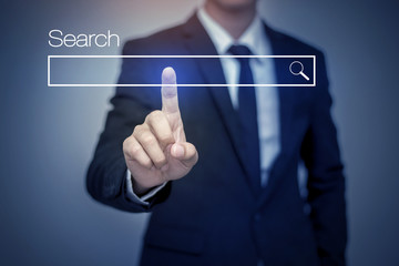 business man clicking internet search page on computer touch scr