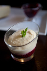Close up photograph of a fancy panna cotta with strawberries