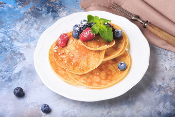 Pancakes with berries and mint