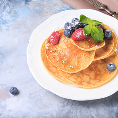 Pancakes with berries and mint