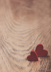 Fototapeta premium Hearts on a wooden background - vintage toning