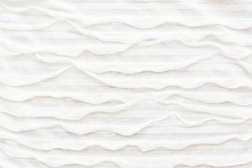 Abstract textile background. White fabric with ruche.