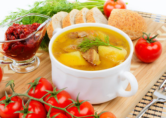 Stewed potatoes in a ceramic pot.