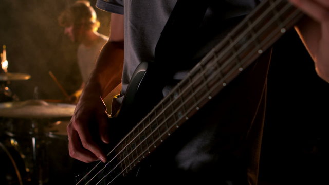 Close up of man playing the bass