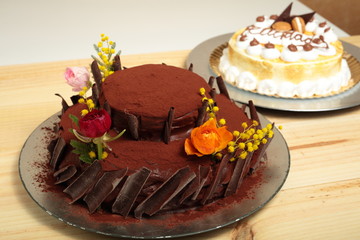 chocolate cake with fresh flowers above