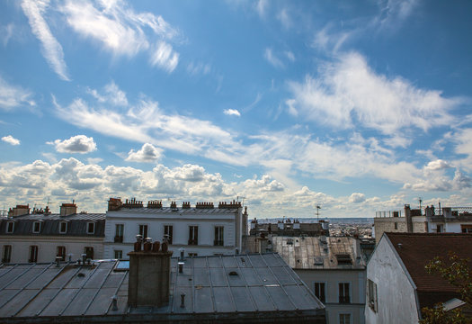 Fototapeta View from Montmartre to summer Paris and beautiful blue sky with soft clouds.