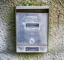 mailbox on a rustic wall