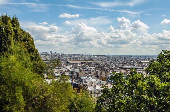 Fototapeta View from Montmartre to summer Paris and beautiful blue sky with soft clouds.