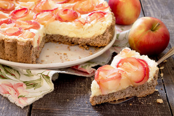 Apple cake with roses, nuts and cream