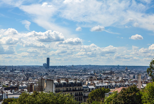 Fototapeta View from Montmartre to summer Paris and beautiful blue sky with soft clouds.