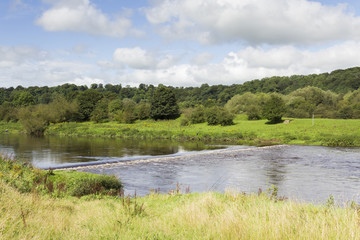 Fototapeta na wymiar Weir on the river Ribble near Preston in the summer of 2012.