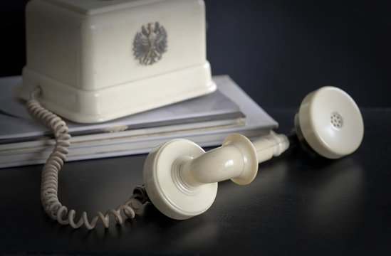Retro telephone / Retro telephone lying on black leather.