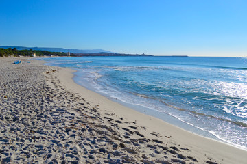 white sand and blue water in Alghero