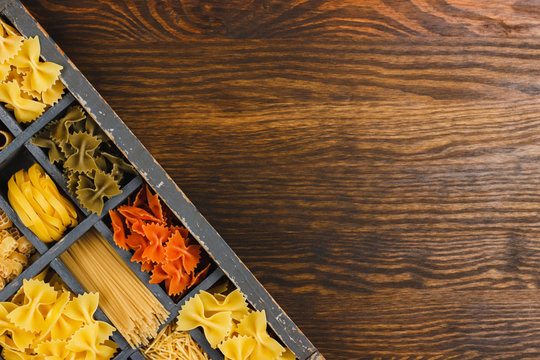 Wooden typesetter case with pasta