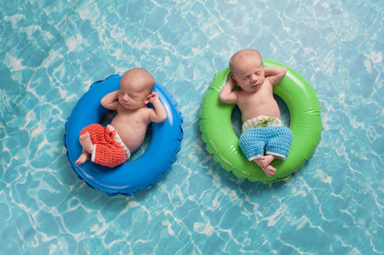 Twin Baby Boys Floating on Swim Rings