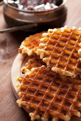 Belgian waffles on wooden table