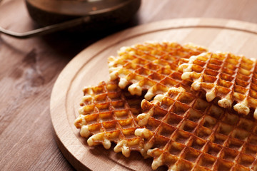 Belgian waffles on wooden table