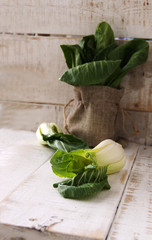 baby bok choy on a wooden table