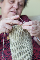 hands of a senior woman knitting