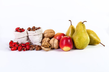 Autumn still life of fruit apples pears nuts rosehips isolated o