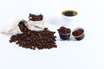 capsules of ground coffee for coffee, roasted coffee beans in a