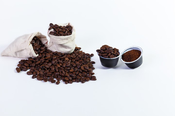 capsules of ground coffee for coffee, roasted coffee beans in a