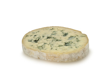 Round piece of blue cheese (Fourme d'Ambert) isolated on white background
