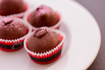 Chocolate Truffles on plate with focus on foreground
