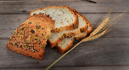 fresh bread and wheat on the wooden