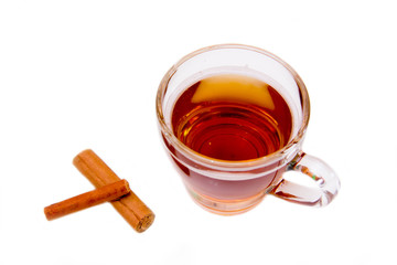 Herbal tea with cinnamon on white background top view