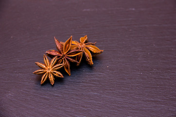 Star anise on slate top seen close