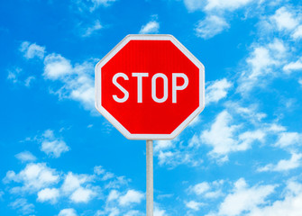 Stop sign against blue sky background 1
