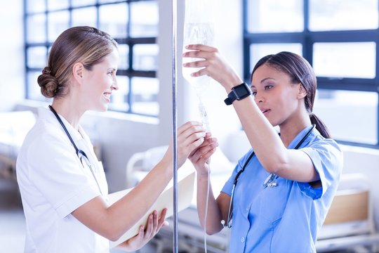 Medical team setting up serum